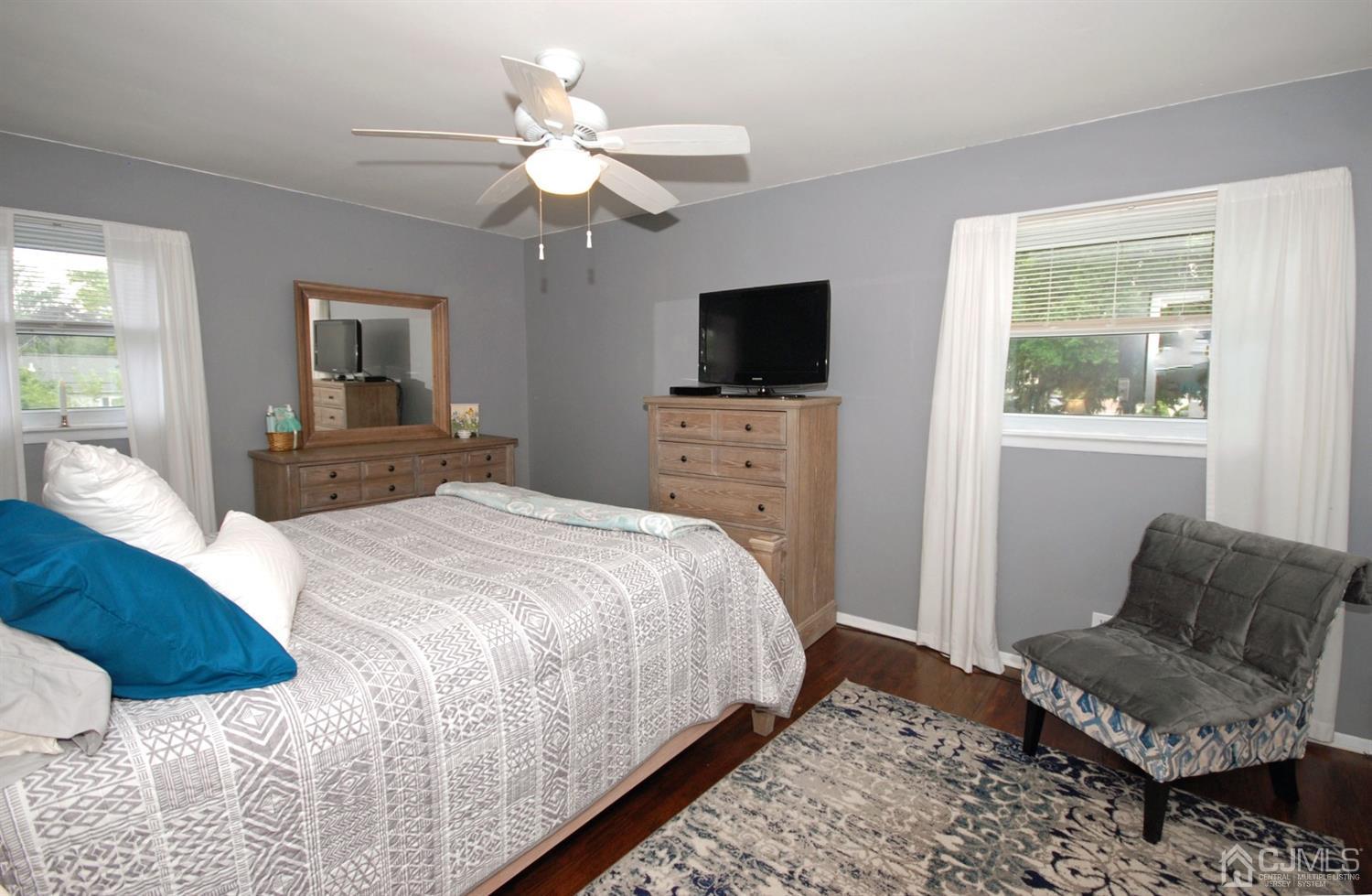 61 Greenbrook Road Middlesex, NJ 08846 - Photo 15 of 29 a bedroom with a bed and a television
