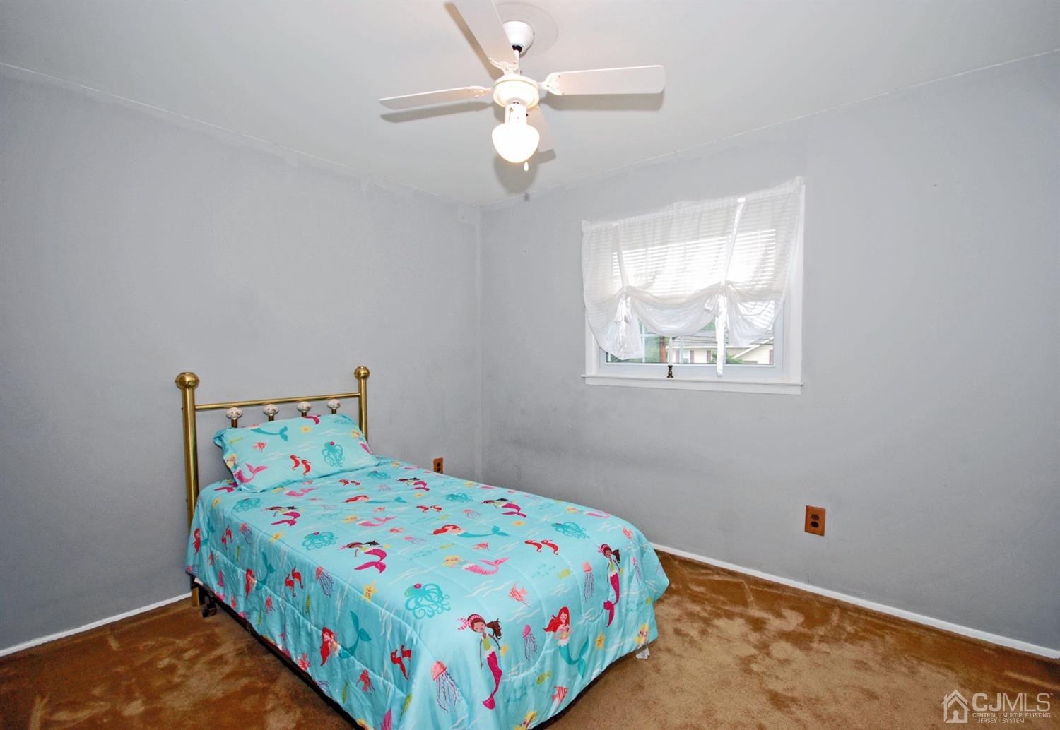 61 Greenbrook Road Middlesex, NJ 08846 - Photo 16 of 29 a bedroom with a bed and a window