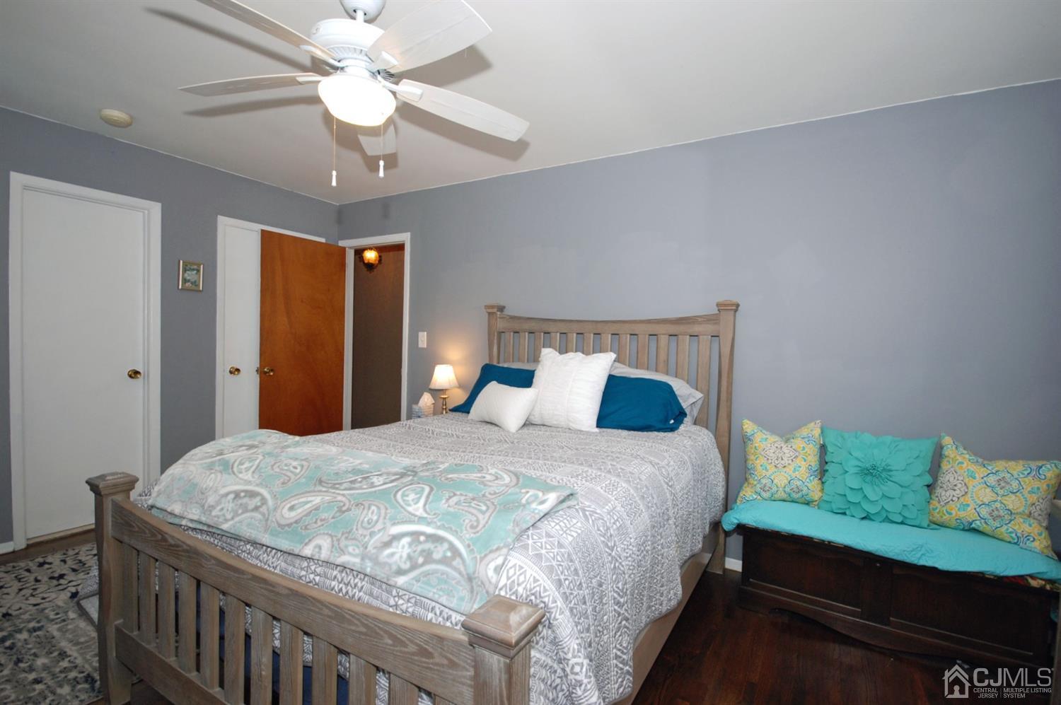 61 Greenbrook Road Middlesex, NJ 08846 - Photo 17 of 29 a bedroom with a bed and a chandelier