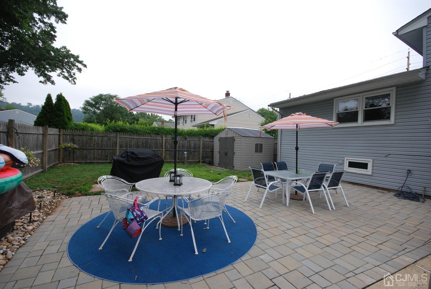 61 Greenbrook Road Middlesex, NJ 08846 - Photo 3 of 29 a patio with table and chairs