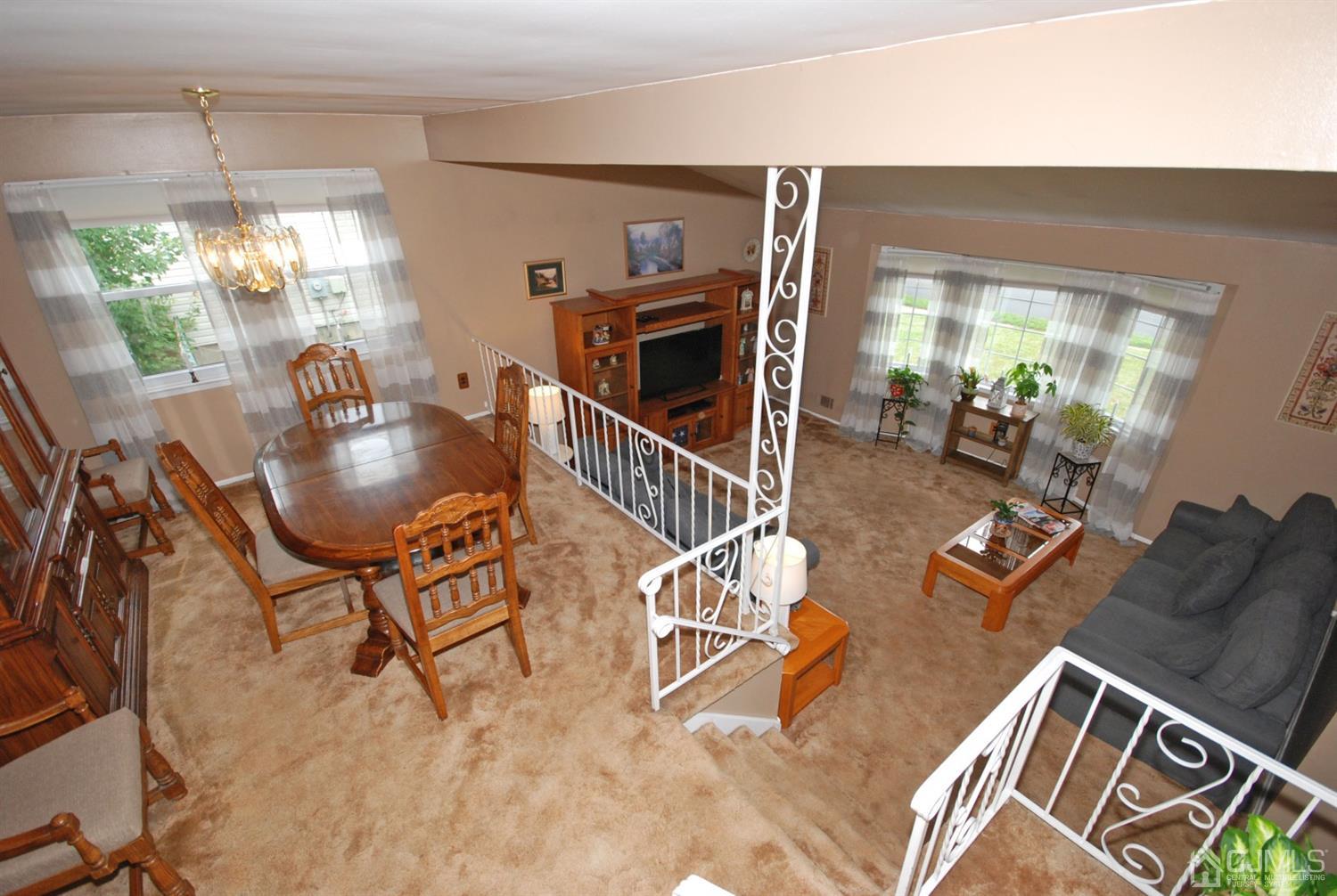 61 Greenbrook Road Middlesex, NJ 08846 - Photo 24 of 29 a living room with furniture and chandelier
