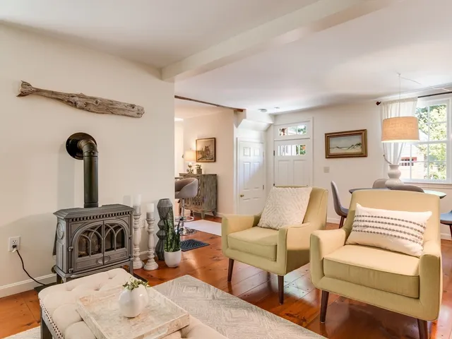 a living room with furniture a couch and a fireplace