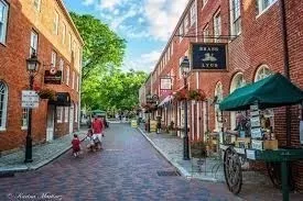 a view of a street with sitting area