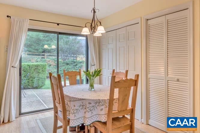 1134 Amber Ridge Road Charlottesville, VA 22901 - Photo 11 of 34 a view of a dining room with furniture window and wooden floor