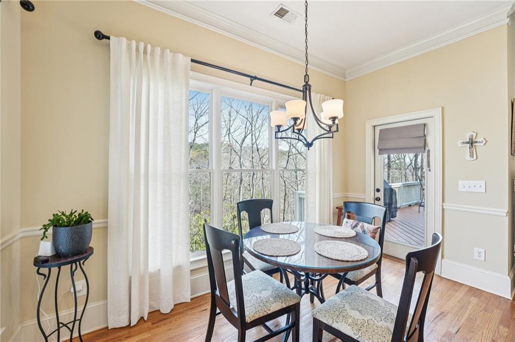 29 Red Trillium Ridge Big Canoe, GA 30143 - Photo 11 of 76 a view of a dining room with furniture window and wooden floor