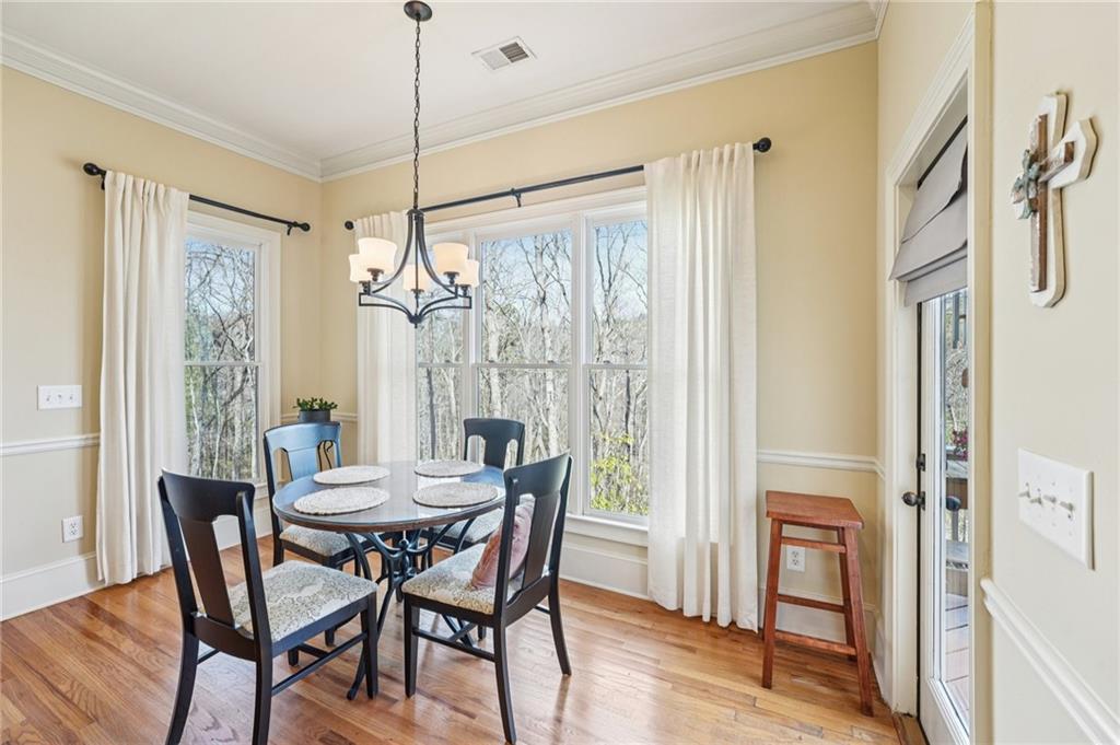 29 Red Trillium Ridge Big Canoe, GA 30143 - Photo 12 of 76 a view of a dining room with furniture window and wooden floor