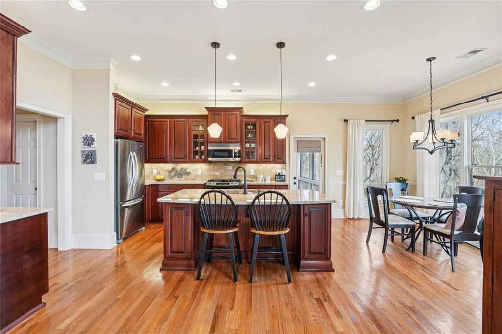 29 Red Trillium Ridge Big Canoe, GA 30143 - Photo 14 of 76 a view of a dining room with furniture window and wooden floor