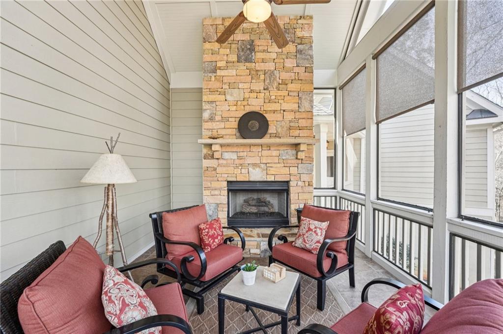 29 Red Trillium Ridge Big Canoe, GA 30143 - Photo 22 of 76 a living room with furniture and a fireplace