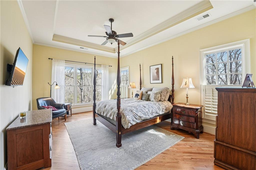 29 Red Trillium Ridge Big Canoe, GA 30143 - Photo 29 of 76 a spacious bedroom with a bed and wooden floor