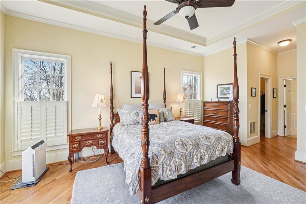 29 Red Trillium Ridge Big Canoe, GA 30143 - Photo 30 of 76 a bedroom with a bed and wooden floor