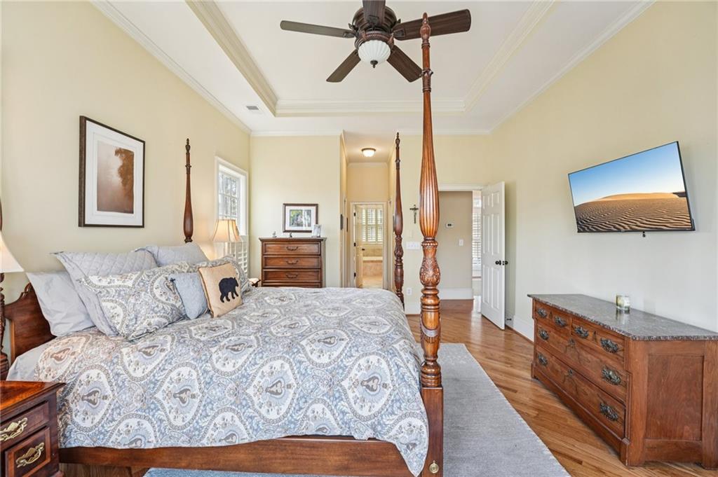 29 Red Trillium Ridge Big Canoe, GA 30143 - Photo 31 of 76 a spacious bedroom with a bed and a flat screen tv