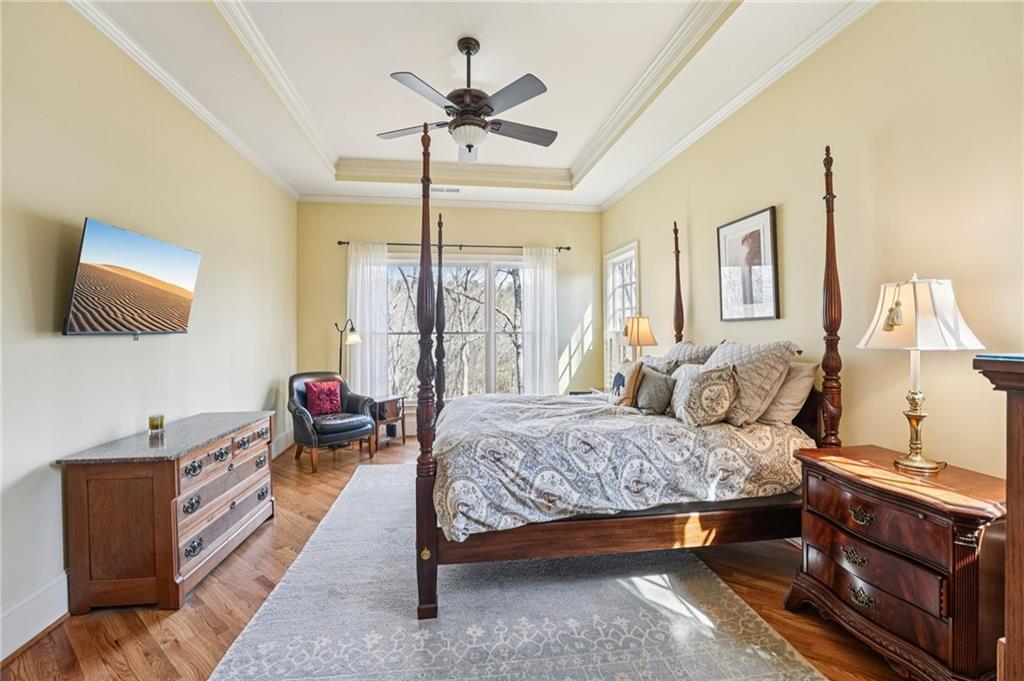 29 Red Trillium Ridge Big Canoe, GA 30143 - Photo 32 of 76 a bedroom with a bed and wooden floor