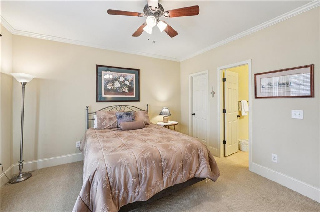 29 Red Trillium Ridge Big Canoe, GA 30143 - Photo 37 of 76 a bedroom with a bed and a painting on the wall