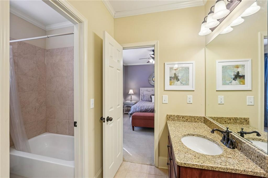 29 Red Trillium Ridge Big Canoe, GA 30143 - Photo 39 of 76 a en suite bathroom with a granite countertop tub sink and mirror