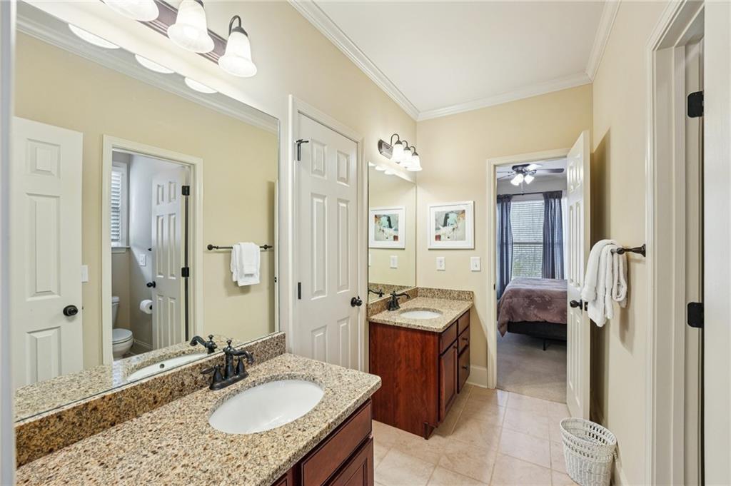 29 Red Trillium Ridge Big Canoe, GA 30143 - Photo 41 of 76 a en suite bathroom with a granite countertop sink mirror and shower