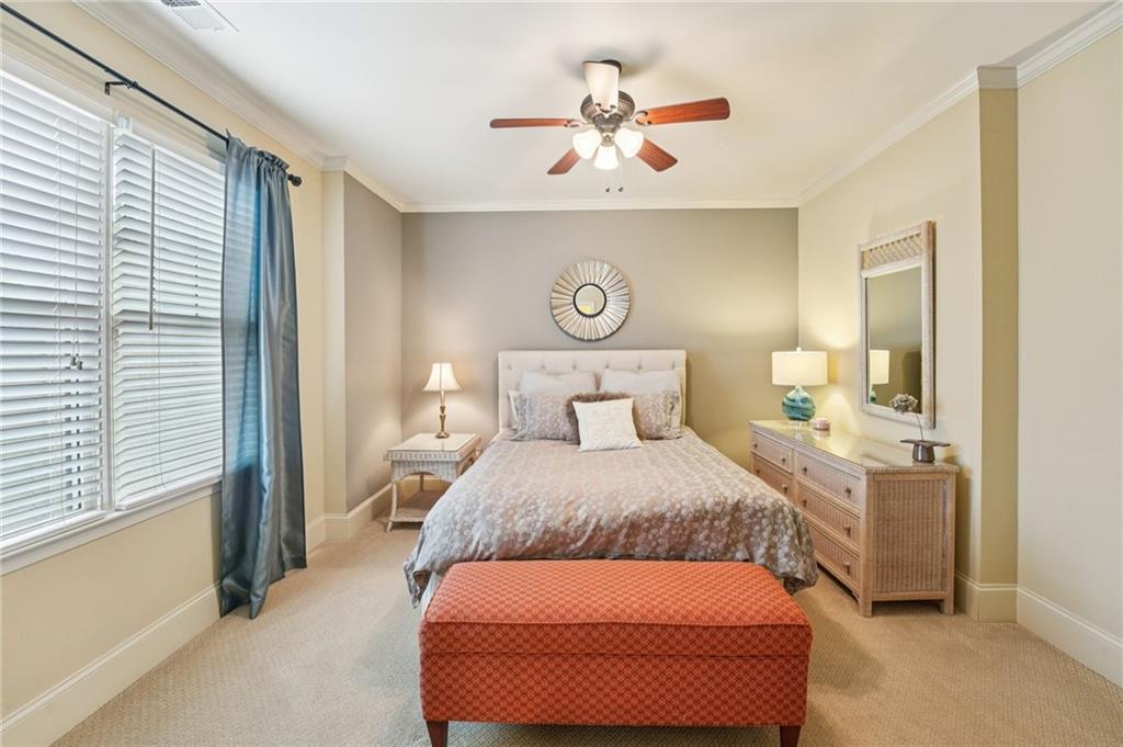 29 Red Trillium Ridge Big Canoe, GA 30143 - Photo 43 of 76 a bedroom with a bed and a chandelier