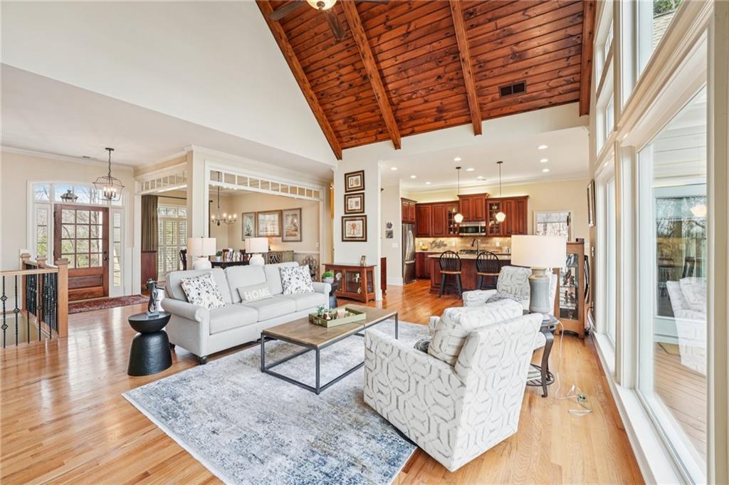 29 Red Trillium Ridge Big Canoe, GA 30143 - Photo 6 of 76 a living room with furniture wooden floor and a table