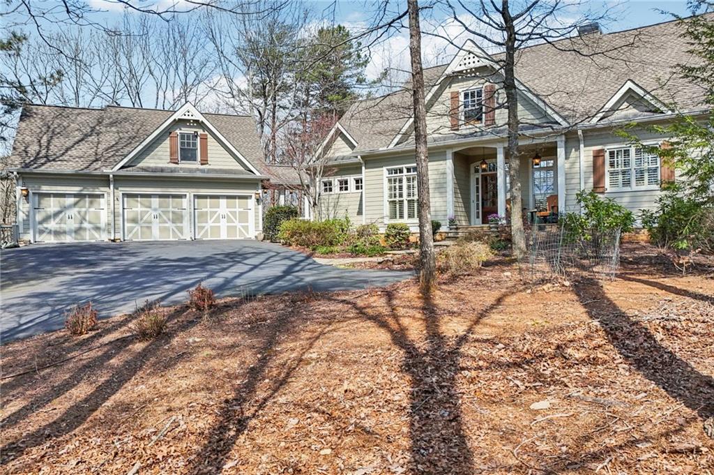 29 Red Trillium Ridge Big Canoe, GA 30143 - Photo 61 of 76 a front view of a house with yard and hallway