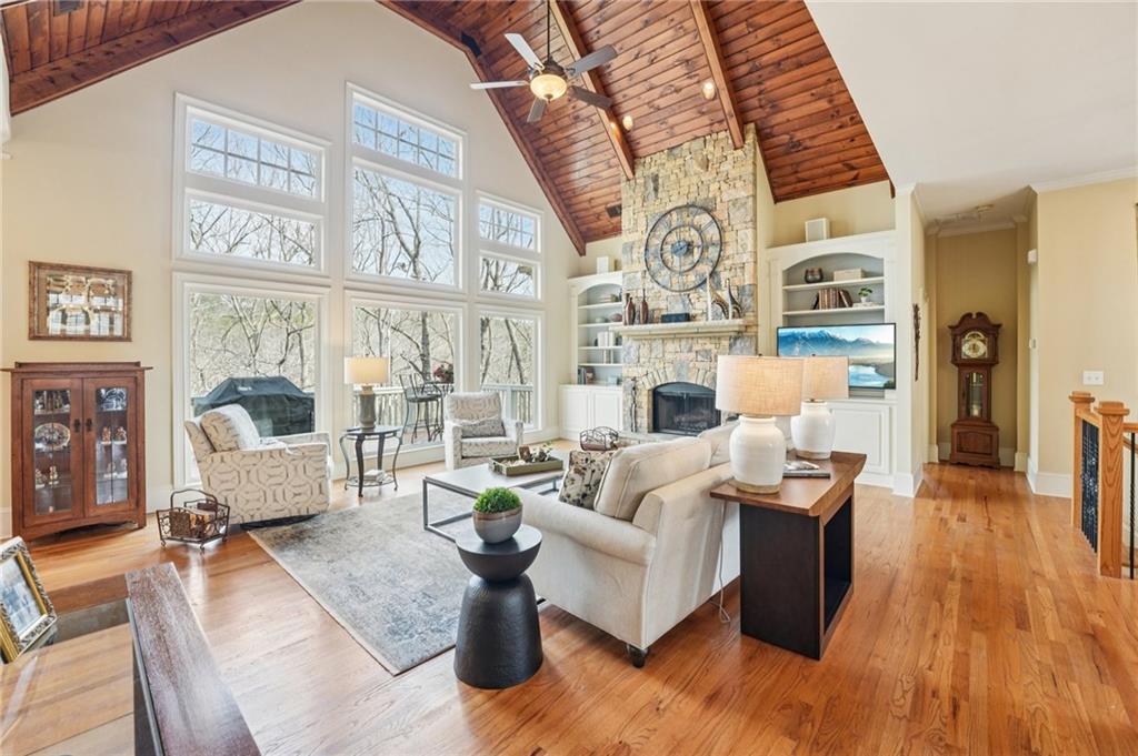 29 Red Trillium Ridge Big Canoe, GA 30143 - Photo 7 of 76 a living room with fireplace furniture and a large window