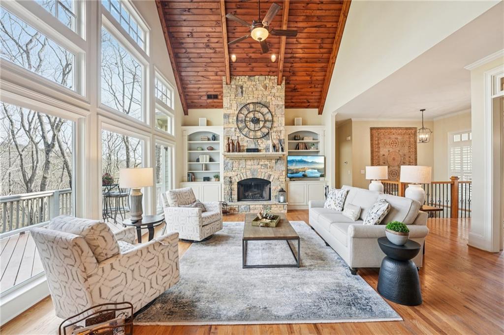 29 Red Trillium Ridge Big Canoe, GA 30143 - Photo 8 of 76 a living room with furniture a fireplace and a chandelier