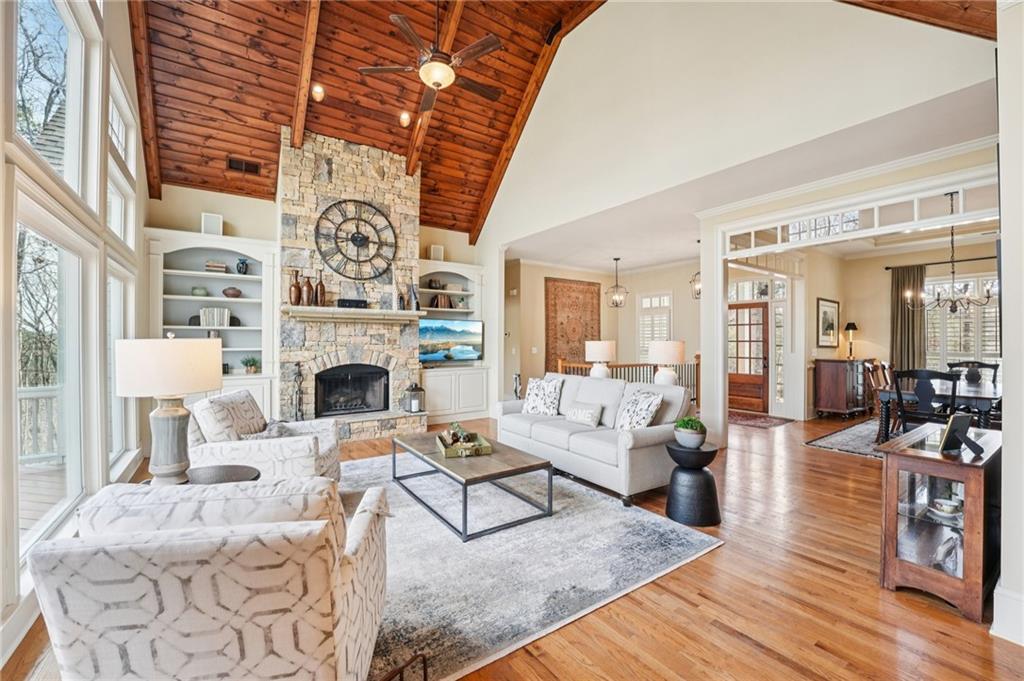 29 Red Trillium Ridge Big Canoe, GA 30143 - Photo 9 of 76 a living room with furniture a fireplace and a table