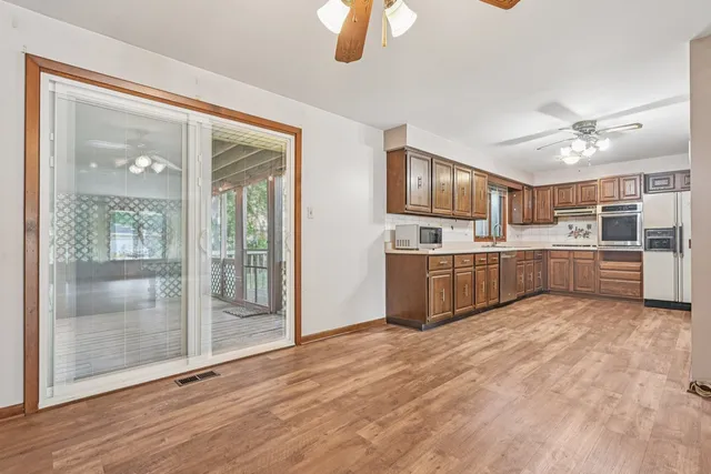 a kitchen with cabinets and window