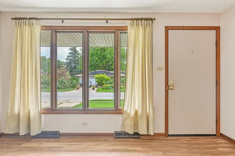a view of a room that has a large window