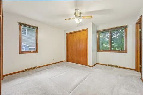 a bathroom with a toilet a sink and a mirror