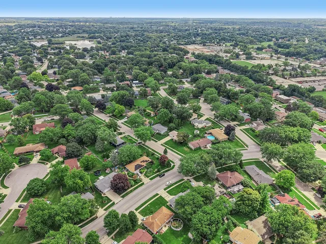 a backyard of a house with lots of green space