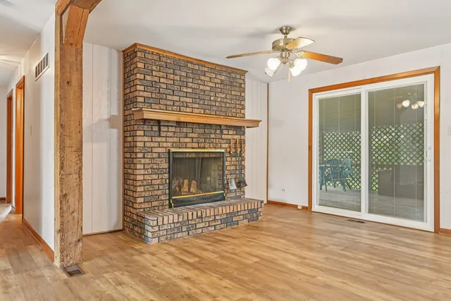 a view of a kitchen with a sink cabinets and a fireplace