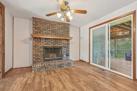 a view of kitchen with cabinets and refrigerator
