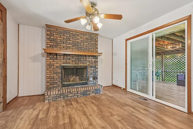 a view of kitchen with cabinets and refrigerator