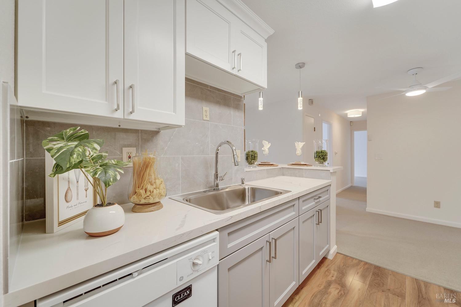 a kitchen with a sink and cabinets