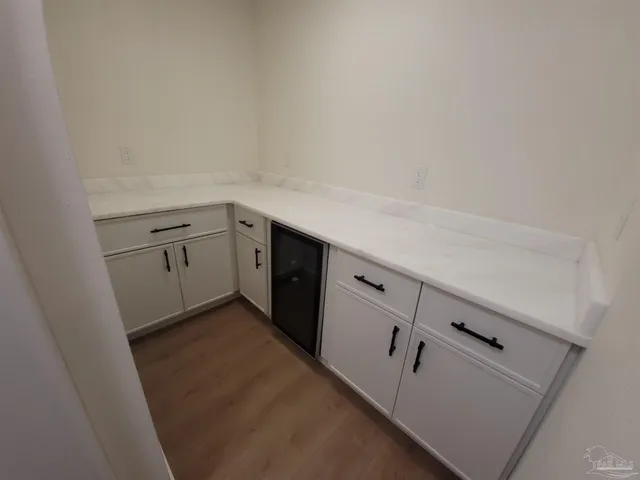 a utility room with cabinets washer and dryer