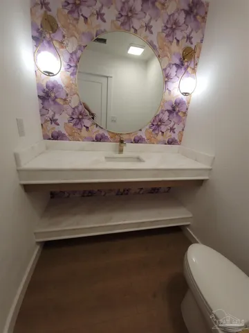 a bathroom with a sink and mirror