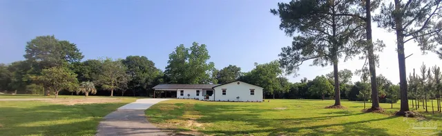 a house with trees in the background