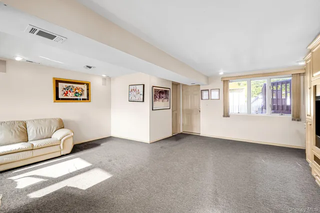 a view of a livingroom with furniture and windows