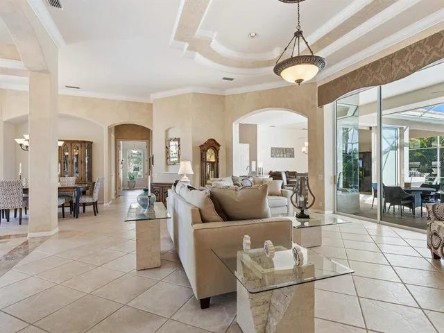 a kitchen with kitchen island granite countertop a large counter top appliances and cabinets