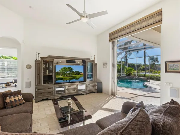 a bathroom with a granite countertop sink a toilet and a mirror