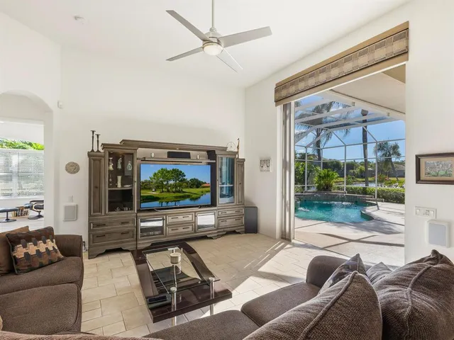 a bath tub sitting next to a white sink