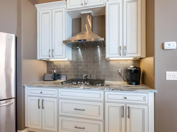 a view of a swimming pool with sitting area