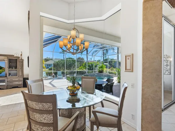 a view of swimming pool with outdoor seating and yard in back