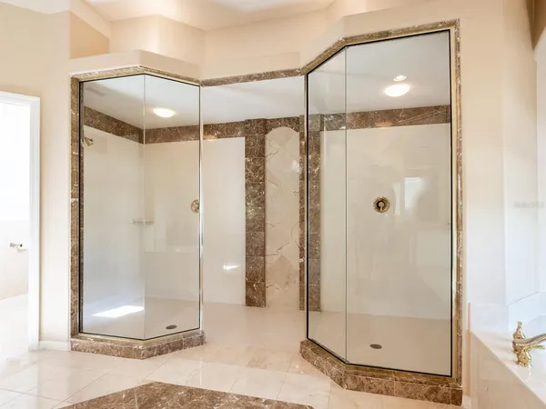 a living room with furniture a chandelier and a flat screen tv