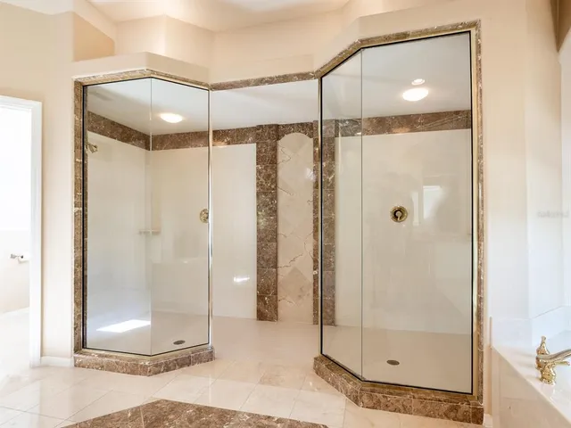 a spacious bathroom with a bathtub and a sink