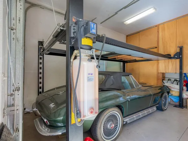 a view of a house with swimming pool and sitting area