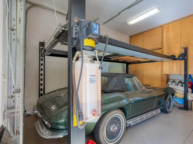 a view of a house with swimming pool and sitting area