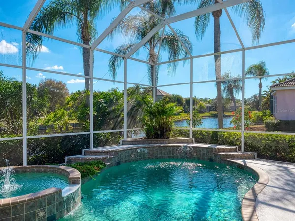 a view of a swimming pool with a lawn chairs
