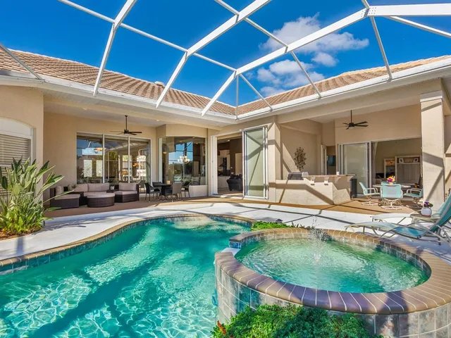 a front view of a house with garden and trees
