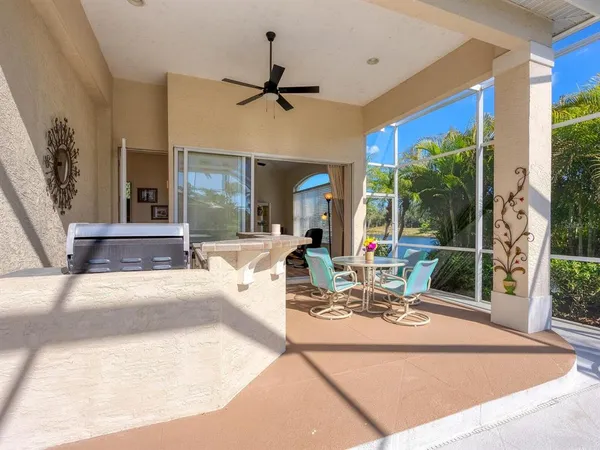 a front view of a house with garden and trees