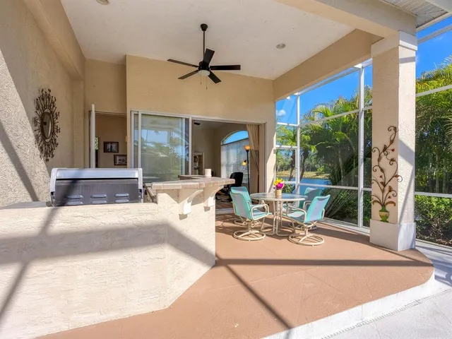 a view of a dining room with furniture wooden floor and chandelier